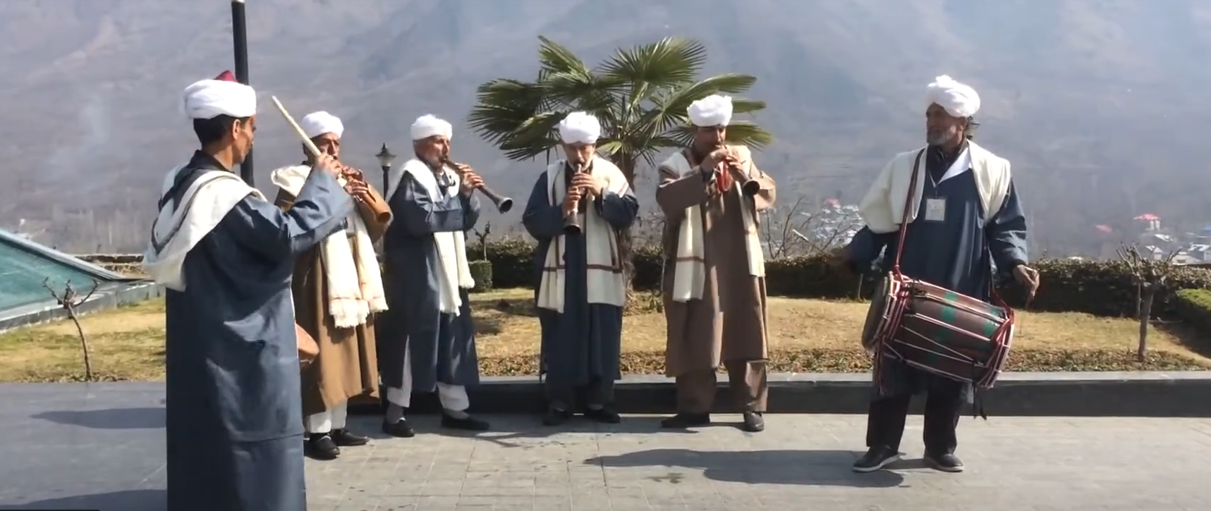 Men playing dhool Men playing dhool