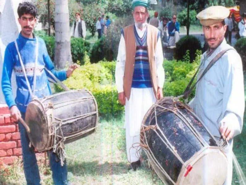 Dhool played by sticks Dhool played by sticks