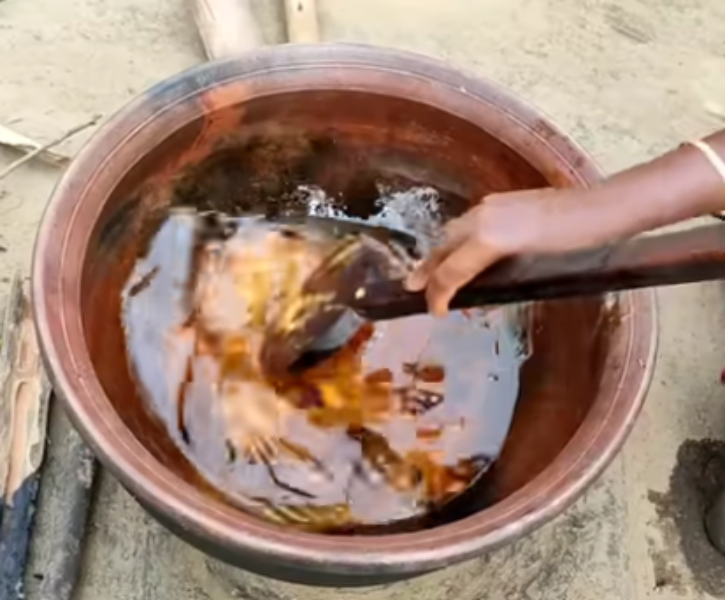 Cooking of Gur Pitha Cooking of Gur Pitha