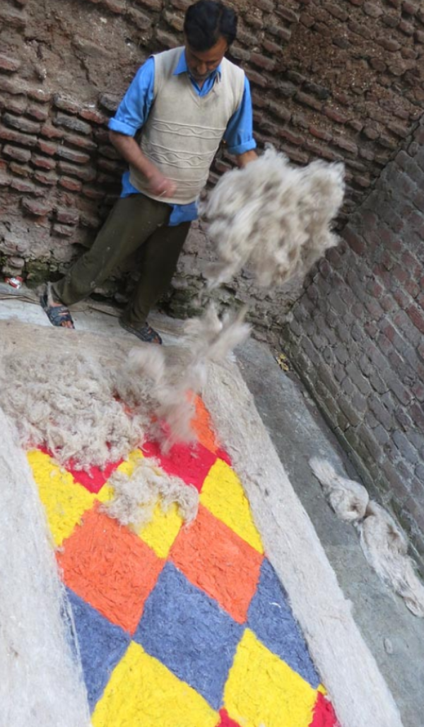 Man working with wool Man working with wool