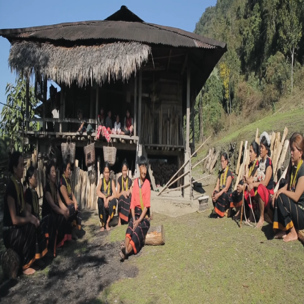 Adi Tribals sitting outside their house Adi Tribals sitting outside their house