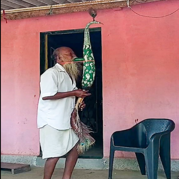 Bhiklya Dhinda with tarpa Bhiklya Dhinda with tarpa